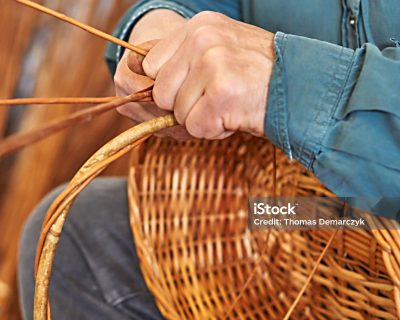a man is weaving a basket